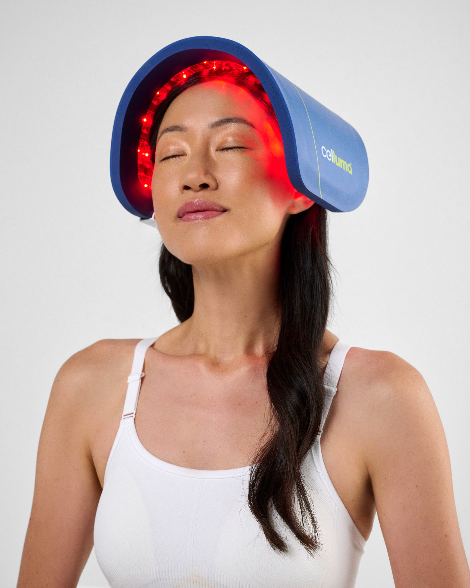Woman wearing an original Celluma light therapy panel